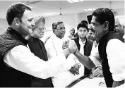  ??  ?? ( From left) Congress Vice-President Rahul Gandhi and Former Prime Minister Manmohan Singh with party colleagues at the AICC office in Delhi on Monday