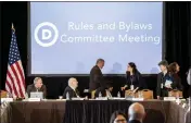  ?? NATHAN HOWARD — THE ASSOCIATED PRESS ?? The Democratic National Committee Rules and Bylaws Committee discusses proposed changes to the primary system during a meeting at the Omni Shoreham Hotel in Washington on Friday.