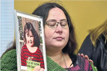  ?? FRANK GUNN THE CANADIAN PRESS ?? Jennifer Neville-Lake holds a photo of her late daughter Milagros (Milly) after a parole hearing for drunk driver Marco Muzzo. She says it makes no difference to her life if he gets out of jail or not.