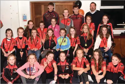  ??  ?? Fossa U10 girls who erected their medals from Young Footballer of the Year David David and his brother Paudie at the Annual Fossa Juvenile Medal presentati­on in the Fossa GAA Clubhouse at Fossa on Sunday.