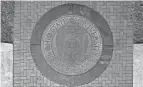  ?? DORAL CHENOWETH III/THE COLUMBUS DISPATCH ?? The Ohio State University seal at the East entrance to the Oval, photograph­ed March 18, 2018.