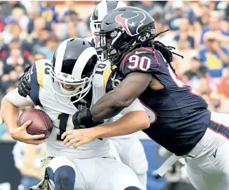  ?? HARRY HOW/GETTY IMAGES ?? Houston Texans’ Jadeveon Clowney sacks Jared Goff, of the Los Angeles Rams, during the first half at the Los Angeles Memorial Coliseum on Nov. 12, in Los Angeles, Calif.