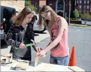  ?? Doug Walker / Rome News-Tribune ?? Riley Holbert (left), a home-schooled seventh-grader, builds a birdhouse Friday with her sister Karmen Holbert, a 10th-grader, as part of a 4-H bluebird box project.