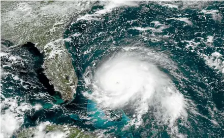  ?? AP ?? This GOES-16 satellite image taken yesterday and provided by National Oceanic and Atmospheri­c Administra­tion, shows Hurricane Dorian churning over the Atlantic Ocean.