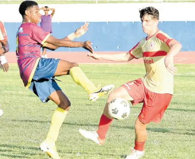  ?? FILE ?? Alexander Bicknell (right) in action for Mona High at Ashenheim Stadium during the 2021 Manning Cup football season. At left is St Andrew Technical’s Namar Nelson.