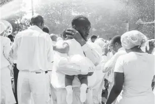  ?? MATT EICH ?? “Fire hose baptism,”Newport News, Virginia, 2013.