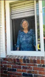  ?? AJC FILE ?? Marsha Tyson (seen during a window visit with her family on Mother’s Day weekend at her nursing home in Dublin) has early-onset Alzheimer’s disease and has forgotten her three children over the months of isolation and lockdown.