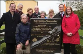  ??  ?? Relatives of Richard Laide who died in the ambush at the new monument unveiled at the site of the old RIC barracks on Sunday.