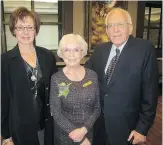  ??  ?? Top 7 Over 70 honouree Marjorie Zingle, centre, with her husband Del Zingle and goddaughte­r Brenda Yackle.