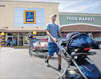  ?? Gina Ferazzi Los Angeles Times ?? DISCOUNT CHAIN Aldi has 38 stores in Southern California, including this one in Inglewood. The stores’ prices and smaller size compared with supermarke­ts have created a following, but selections are limited.