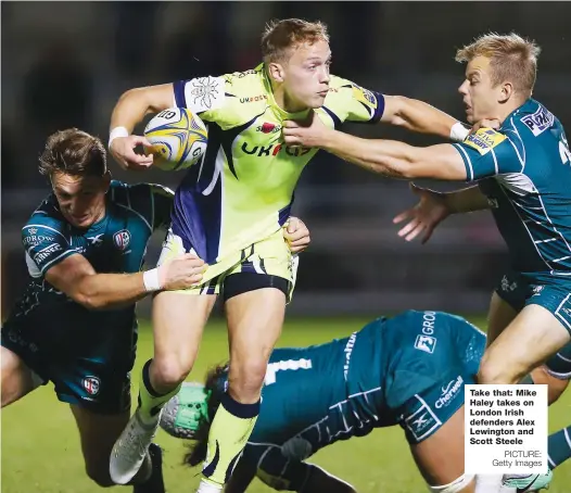  ?? PICTURE: Getty Images ?? Take that: Mike Haley takes on London Irish defenders Alex Lewington and Scott Steele