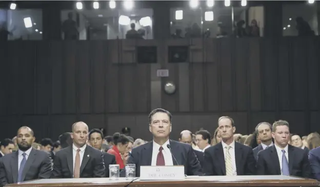  ?? PICTURE: ALEX BRANDON/AP ?? 0 Former FBI director James Comey listens to the committee chairman during the Senate intelligen­ce committee hearing on Capitol Hill