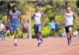  ?? MARLA BROSE/JOURNAL ?? Manzano’s Jordan Byrd, center, sprints to a victory in the 100-meter dash during the Richard A. Harper Memorial Track Meet at Albuquerqu­e Academy last year. Byrd will seek a fourth consecutiv­e state title for the 100-meter dash in May.