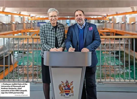  ?? University of Plymouth ?? > Professor Judith Petts of the University of Plymouth and Andrew Jamieson, chief executive of the ORE Catapult, sign the COSS partnershi­p