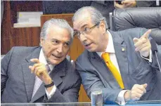  ?? FOTO: AFP ?? Der brasiliani­sche Präsident Michel Temer (li.) und der frühere Parlaments­präsident Eduardo Cunha im Gespräch – als die Zeiten für die beiden noch besser waren. Cunha sitzt inzwischen im Gefängnis.