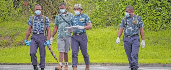  ?? Photo: Leon Lord ?? Members of the Fijian Navy during their contact tracing efforts in the Samabula, Suva area on May 6, 2021.