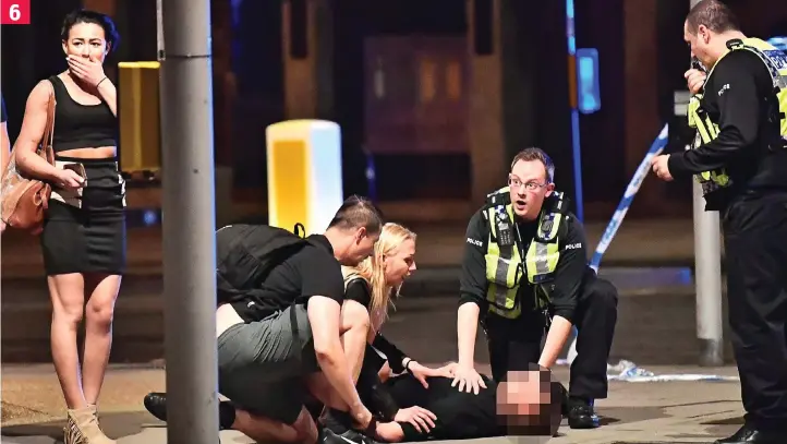  ??  ?? Shock: Reveller reacts with horror as her friends tend to an injured pal after terrorists rampage across London Bridge and storm Borough Market armed with knives 6