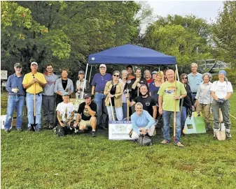  ?? COURTESY PHOTO ?? This volunteer crew removed invasives and planted new trees, shrubs and grasses along the Sperryvill­e River Walk.