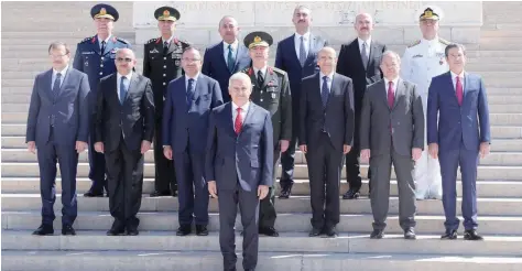  ?? — AFP ?? Turkey’s Prime Minister Binali Yildirim (C) poses with members of the Supreme Military Council members during their visit to Anitkabir in Ankara on Wednesday.