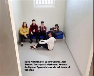  ??  ?? Daria Marinskait­e, Jack O’Connor, Alex Szwarc, Tautvydas Sniezka and Aneena Juddymon Pynadath take a break in one of the cells.