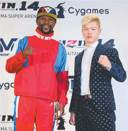  ?? NOT ON: US boxer Floyd Mayweather with Japanese kickboxer Tenshin Nasukawa but says he never agreed to an official bout. ??