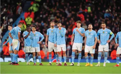  ?? ?? Manchester City players react with dismay after losing the penalty shootout