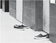  ?? DIRK SHADD/TAMPA BAY TIMES 2016 ?? There are 43,000 minors in U.S. detention facilities. Above, shoes of offenders outside confinemen­t rooms in Florida.