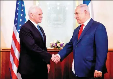  ?? ARIEL SCHALIT/AFP ?? US Vice President Mike Pence (left) shakes hands with Israeli Prime Minister Benjamin Netanyahu during their meeting at the prime minister’s office in Jerusalem yesterday.