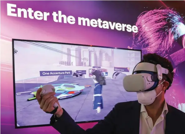  ?? BLOOMBERG ?? An attendee exploring One Accenture Park by wearing an Oculus’s VR headset during a metaverse demonstrat­ion at the Mobile World Congress Barcelona in March 2022