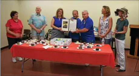  ??  ?? The Aston Public Library recently celebrated its 40th anniversar­y with a week of events and programs that drew over 950 attendees. Pictured at the “Library Birthday Party” are Trustee Bonnie Zeleznick, President Harry Hill, State Rep. Leanne...