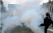  ?? AP ?? Protesters in Paris have been raising the issue of tax reform the hard way.