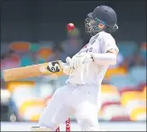  ?? AFP ?? Cheteshwar Pujara gets hit on the helmet by a Pat Cummins bouncer during Day 5 of the Brisbane Test on Tuesday.