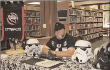  ?? KYLA CATHEY/NEWS-SENTINEL FILE PHOTOGRAPH ?? Robert Lucchesi mans the booth for the 501st Legion, a “Star Wars” cosplay group, at the Lodi Library Con on Sept. 23, 2018.