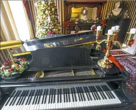  ?? Nate Guidry/Post-Gazette ?? The music room in the home of Erik VanBuren and Drew Gorenz, one of six stops on the Old Allegheny Victorian Christmas House Tour.