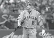  ?? Fred Thornhill Associated Press ?? A DEJECTED Albert Pujols walks back to the dugout after striking out with the bases loaded Friday.