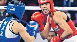  ?? SANJEEV VERMA / HT ?? Manisha Maun (red) against Kazakhstan`s Dina Zholaman in women's 64 kg category bout in New Delhi on Sunday.