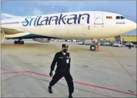  ?? AGENCIES ?? Anti-government demonstrat­ors scuffle with police during a protest in Colombo, Sri Lanka, on Monday and a file photo of the Sri Lankan airlines aircraft.