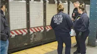  ?? SAM COSTANZA FOR NYDN ?? Police investigat­e scene at 125th St. subway platform where Jason Volz (below) died after being pushed into the path of a No. 4 train Monday.