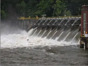  ?? The Sentinel-Record/Mara Kuhn ?? ALL GATES OPEN: Around 45,000 cubic feet per second of water rushes from Remmel Dam on Sunday morning following heavy rains overnight.