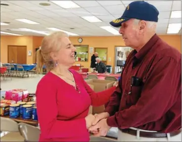  ?? BRIAN HUBERT — DAILY FREEMAN ?? Gaetana Ciarlante, founder and director of the group Operation SOS (Support Our Service people) greets Craig Smith, a U.S. Marine veteran, at the Frank D. Greco Senior Citizens Center in Saugerties, N.Y., on Sunday.