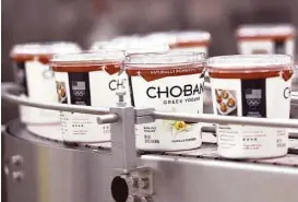  ?? Drew Nash / Times-News ?? Yogurt containers are sorted at a Chobani plant near Twin Falls, Idaho. Chobani is giving its employees an ownership stake in the privately held company.