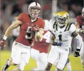  ?? Tony Avelar Associated Press ?? STANFORD’S Christian McCaffrey runs past UCLA’s Ishmael Adams for a touchdown last year.