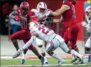  ?? Arkansas Democrat-Gazette/JEFF GAMMONS
Arkansas State running back Marcel Murray (left) dodges a tackle Saturday during a game against SMU at Centennial Bank Stadium in Jonesboro. ??