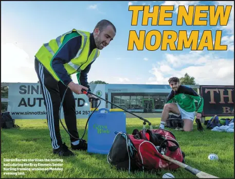  ??  ?? Ciarán Barnes sterilises the hurling balls during the Bray Emmets Senior hurling training session on Monday evening last.