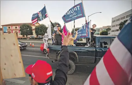  ?? Jason Armond Los Angeles Times ?? backers of President Trump rally Saturday after Joe Biden was declared president- elect. In the liberal Westside, two neighborho­ods in the 90210 were conspicuou­s for not supporting Biden. “Trump has been very good for rich people,” a resident said.