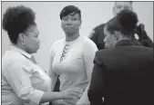  ?? Max Faulkner
/ Fort Worth Star-telegram /TNS ?? Crystal Mason (center), convicted of illegal voting and sentenced to five years in prison, at thetim Curry Justice Center in Fort Worth,texas, on May 25, 2018.