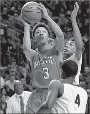  ?? Arkansas Democrat-Gazette/STEPHEN B. THORNTON ?? Guard Tevin Brewer (3) drives to the basket for two of his 18 points in Fort Smith Northside’s victory over North Little Rock on Saturday. Brewer also pulled down six rebounds to earn MVP honors.