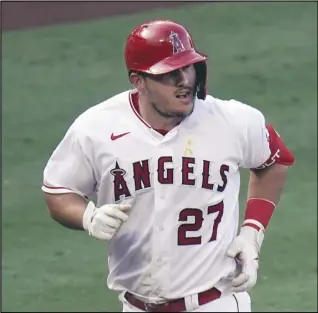  ?? Associated Press ?? MORE TO ACCOMPLISH —
Angels outfielder Mike Trout rounds the bases after hitting a two-run home run against the Houston Astros on Sept. 5. Trout is back in spring training with the Angels to chase his first playoff victory. The three-time AL MVP is growing weary of hearing the annual questions about when he’ll finally reach that career milestone.