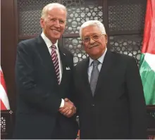  ?? Reuters/File ?? US presidenti­al hopeful Joe Biden, left, shakes hands with Palestinia­n President Mahmoud Abbas in the West Bank city of Ramallah.