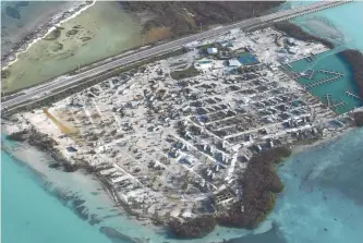  ?? EPA-Yonhap ?? Overturned trailer homes are shown in the aftermath of Hurricane Irma in the Florida Keys, Monday. Florida is cleaning up and embarking on rebuilding from Irma, one of the most destructiv­e hurricanes in its history.